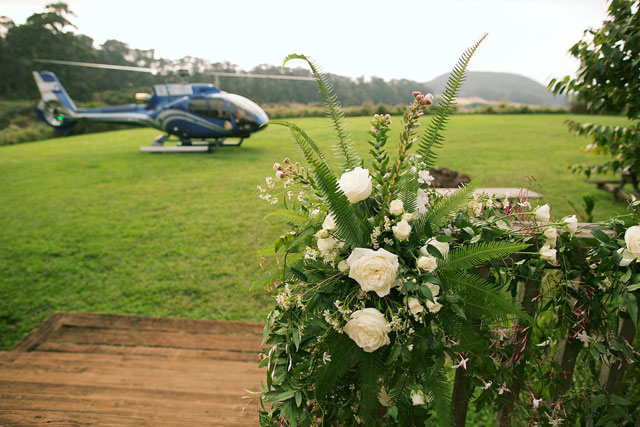 A lavish Maui destination wedding including a helicopter ride, orchids and a vibrant tropical color palette by Anna Kim Photography