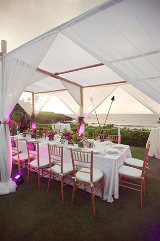 A lavish Maui destination wedding including a helicopter ride, orchids and a vibrant tropical color palette by Anna Kim Photography