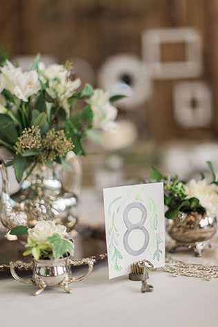 A beautiful lakeside calligraphy inspired wedding with vintage rentals and greenery by B. Jones Photography