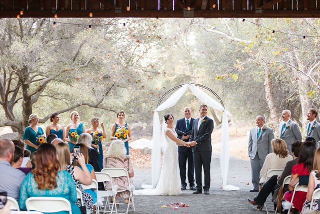 A rustic autumn River Ridge Ranch wedding with sunflowers and a fire pit by Bergreen Photography