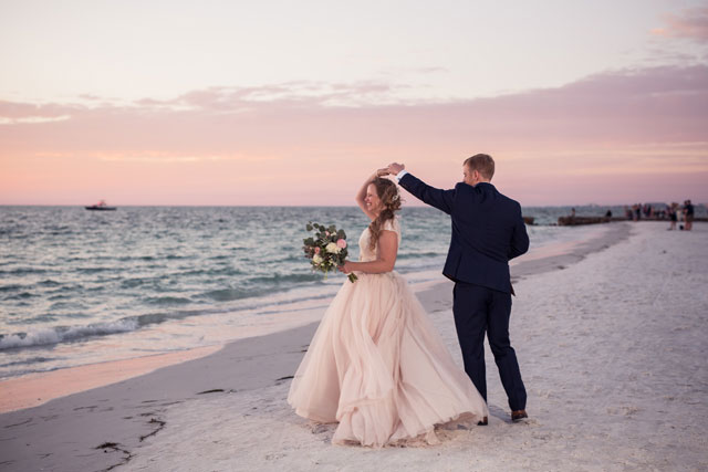 A beautiful, rustic beachside Siesta Key wedding with vintage furniture, a s'mores station and a dance floor under the stars by Cat Pennenga Photography