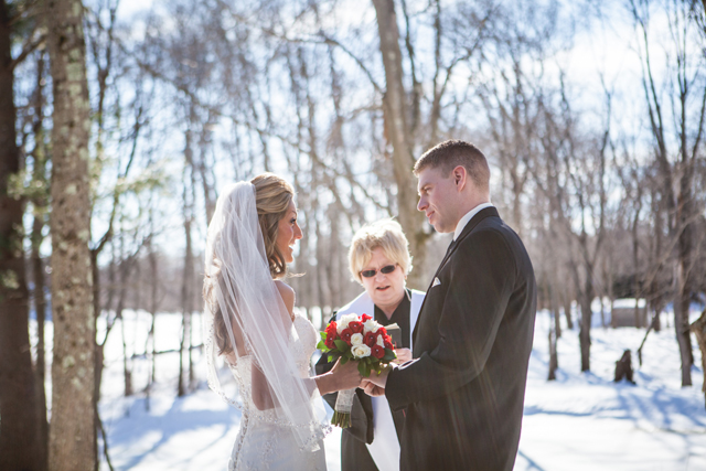 An intimate outdoor winter ceremony with the couple's dogs, hockey sticks and snowmobiles by HilaryColleen Photography || see more on blog.nearlynewlywed.com