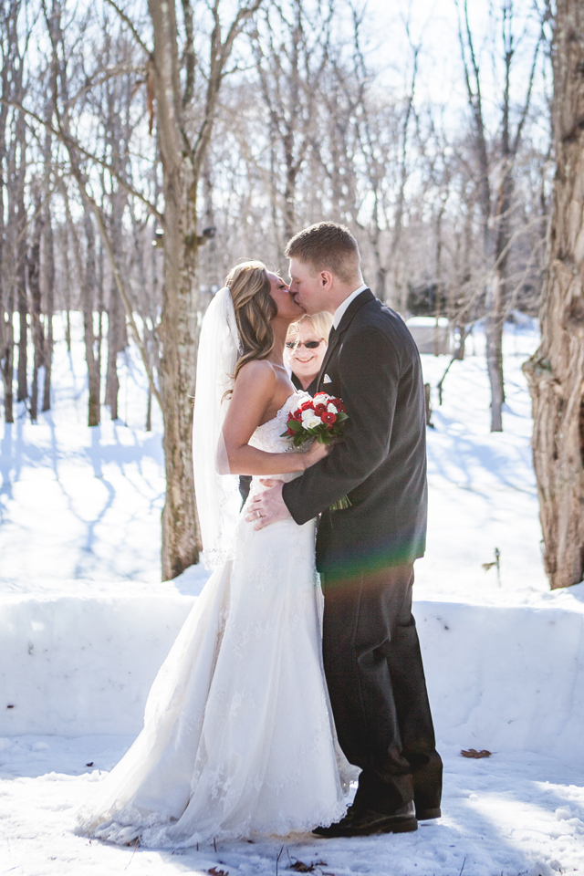 An intimate outdoor winter ceremony with the couple's dogs, hockey sticks and snowmobiles by HilaryColleen Photography || see more on blog.nearlynewlywed.com