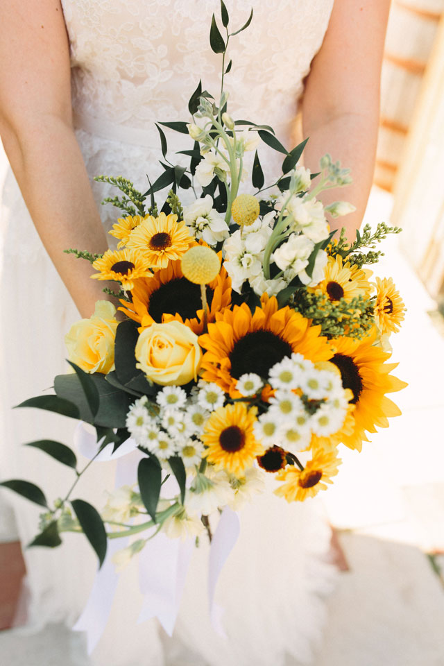 A beautiful and rustic Sassafras Springs Vineyard wedding with sunflowers by Prairie to Pacific and Most Joyful Day