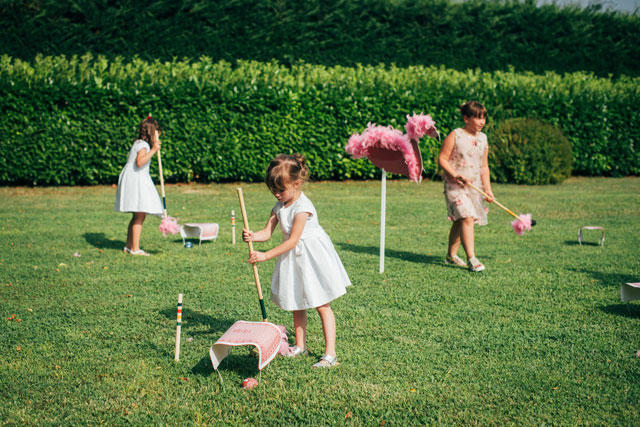 A fabulously fun and quirky wedding in Wonderland in Italy with a Mad Hatter's tea table, flamingo croquet and Caterpillar's hookah by Selene Pozzer