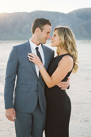 A James Bond inspired desert escape engagement session with a Porsche and a dry lake bed by Taylor Abeel Photography