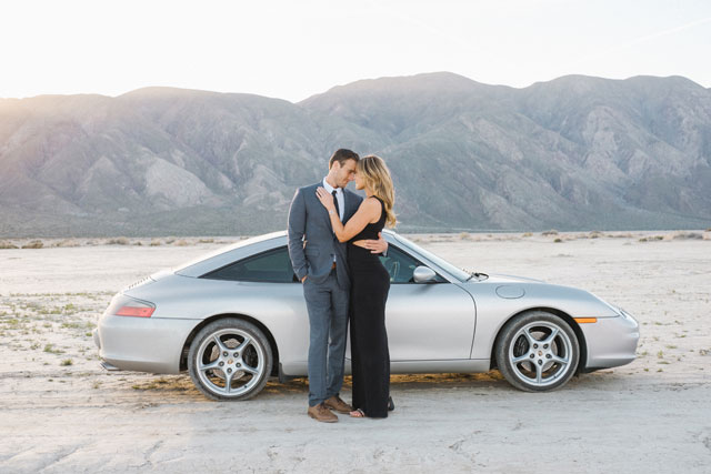 A James Bond inspired desert escape engagement session with a Porsche and a dry lake bed by Taylor Abeel Photography